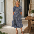 Jenna | Robe mi-longue imprimée avec poches et jupe évasée
