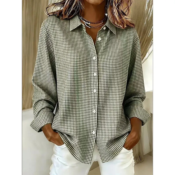 Woman wearing gingham button-up blouse with long sleeves