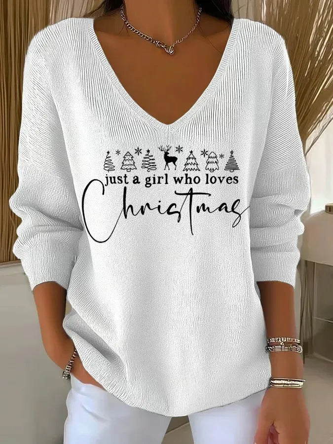 Woman wearing festive V-neck Christmas sweater indoors