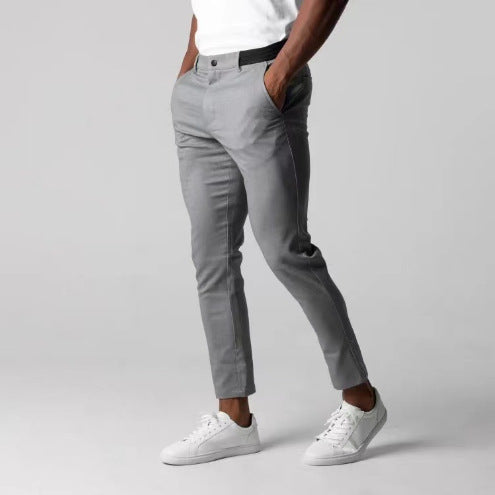 Man wearing slim straight business dress pants