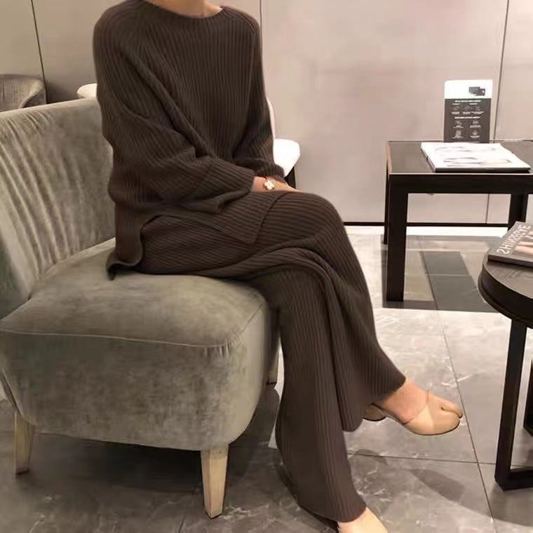 Woman wearing knit sweater top and wide-leg pants suit