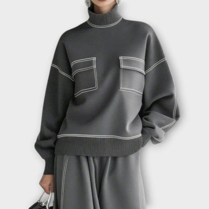 Woman wearing charcoal gray mock neck two-piece set