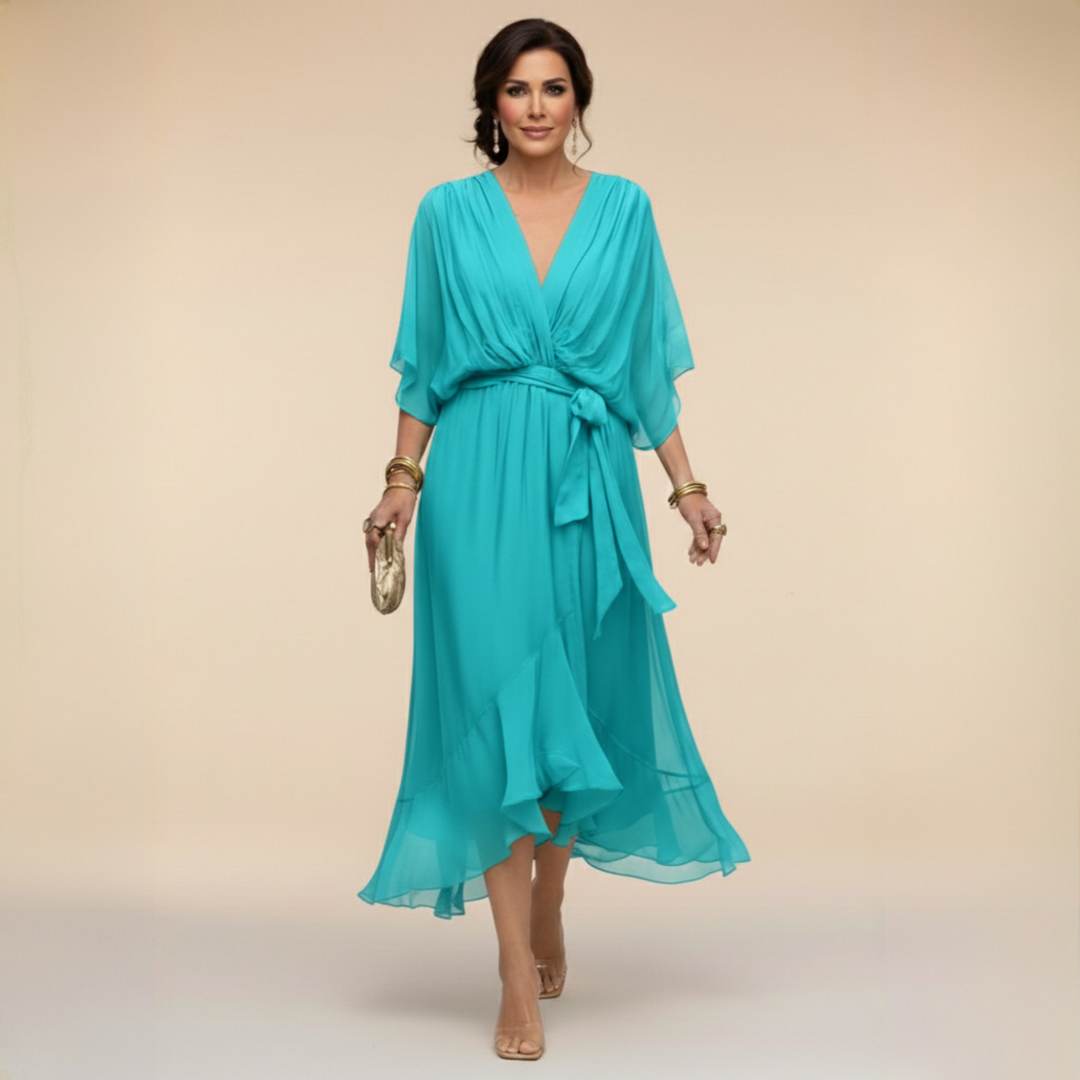 Woman wearing flowy V-neck dress, front view