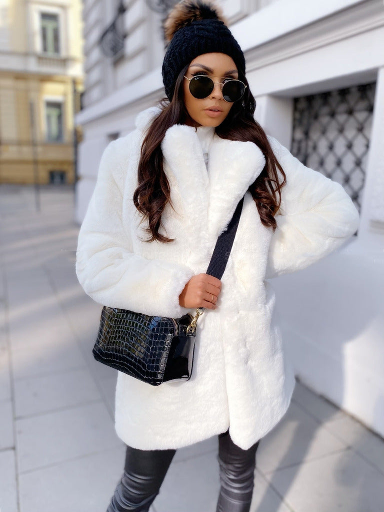 Woman wearing long faux fur coat with lapel collar