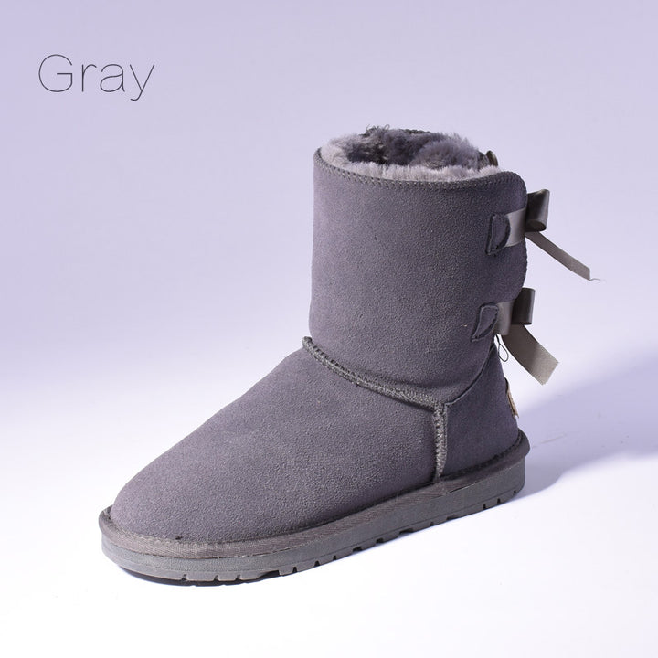 Women's mid-calf snow boots with fur lining and bow detail