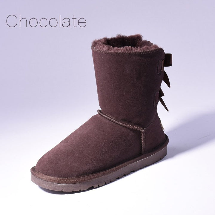 Women's mid-calf snow boots with fur lining and bow detail