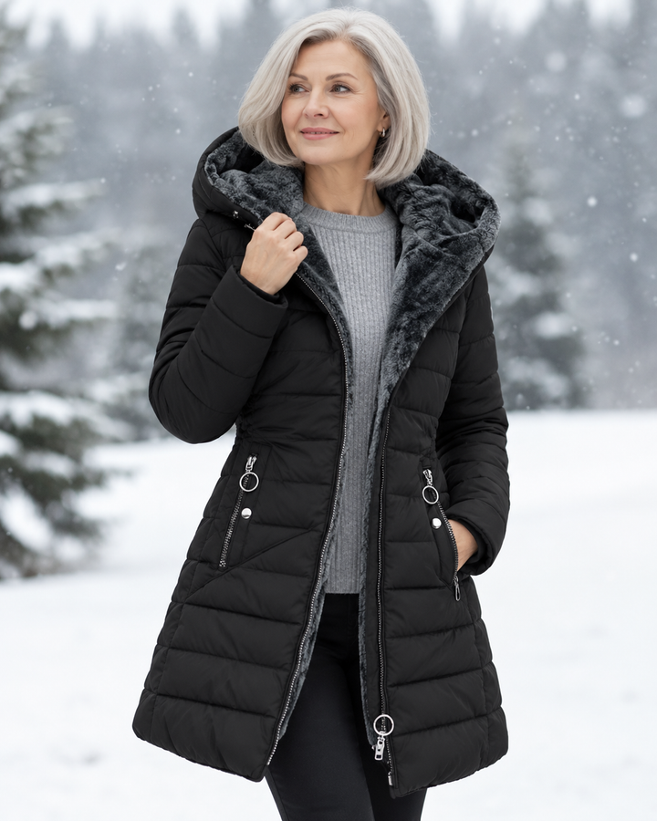 Woman wearing padded winter coat with hood