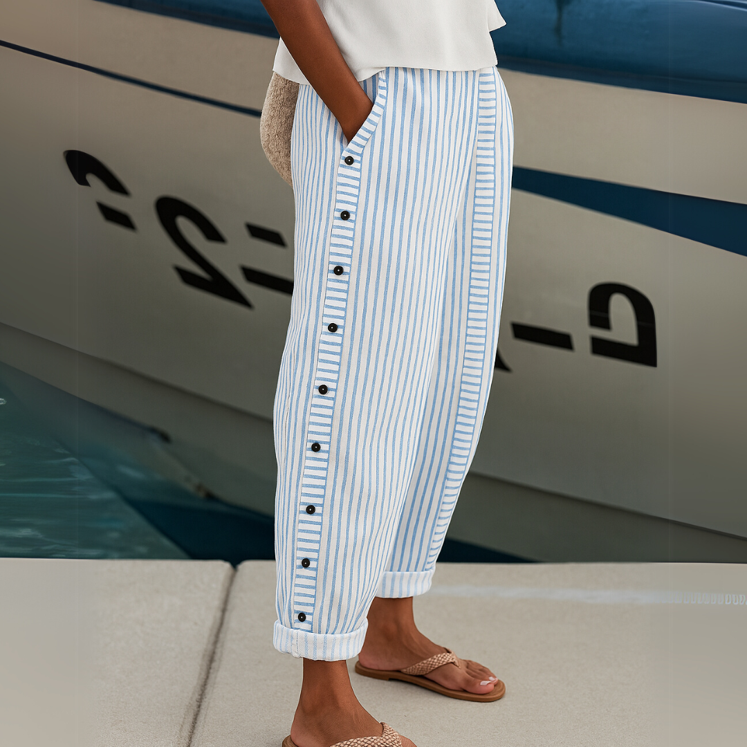 Woman wearing black striped high waisted button pants