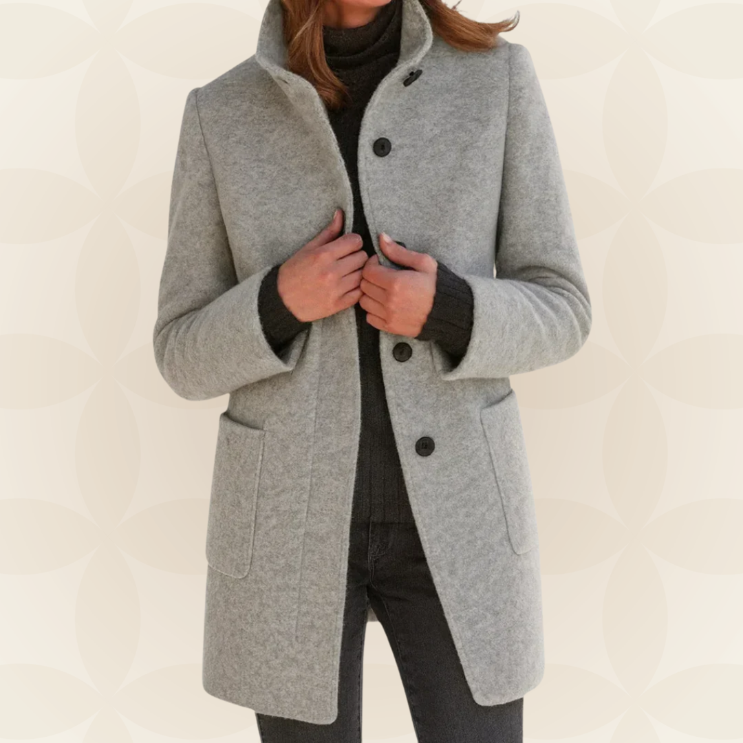 Woman wearing a classic coat with high collar