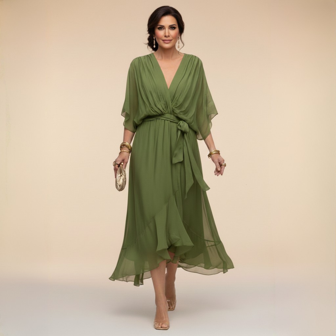 Woman wearing flowy V-neck dress, front view