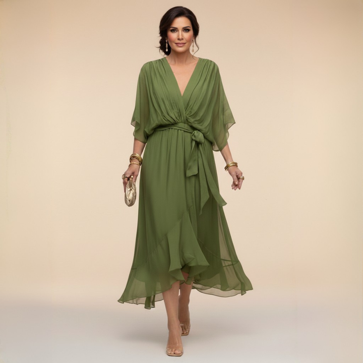 Woman wearing flowy V-neck dress, front view