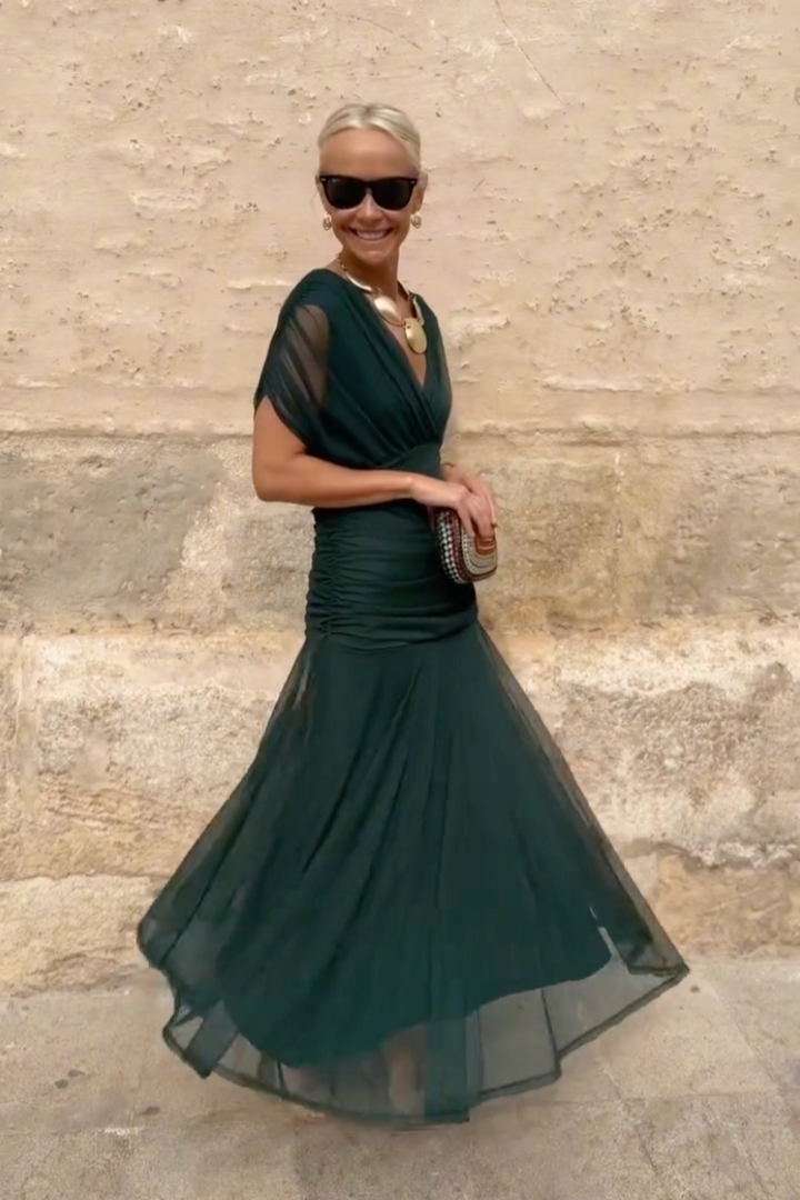 Woman in floral print V-neck maxi dress