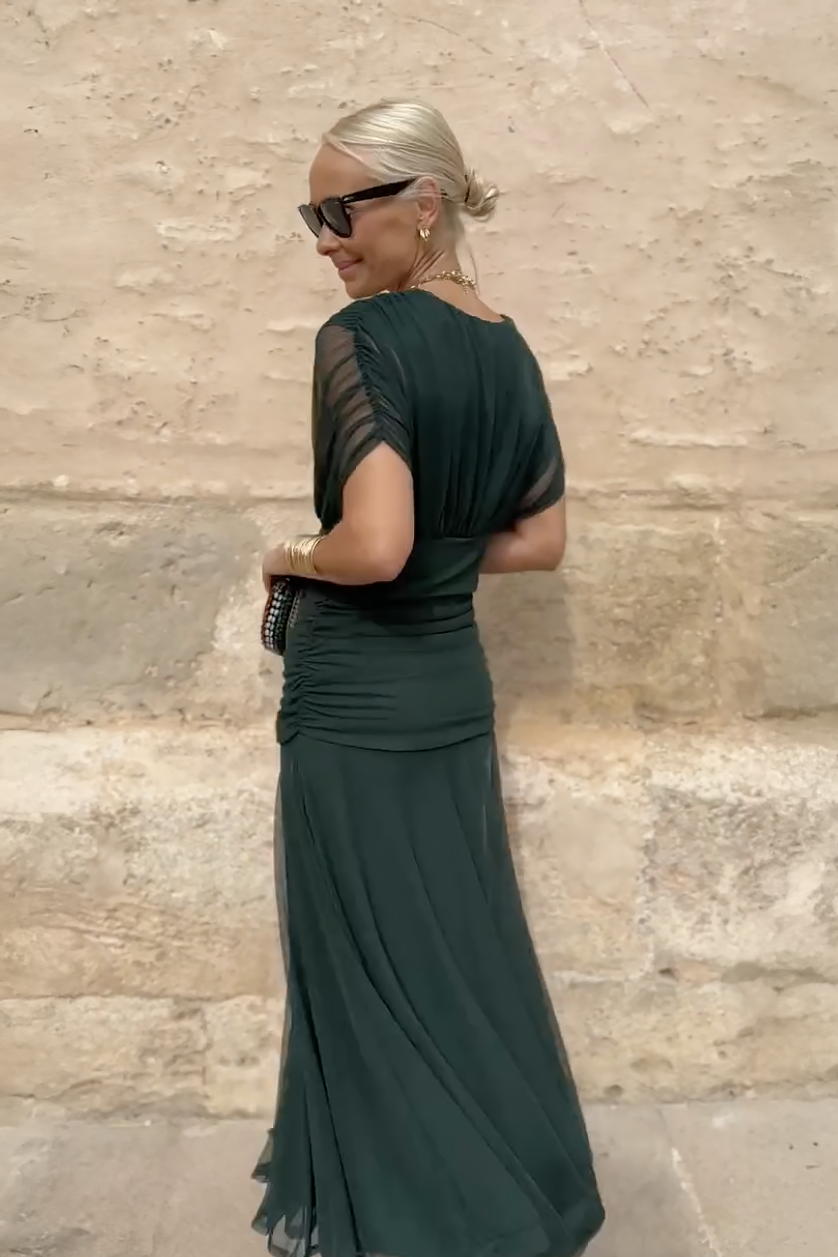 Woman in floral print V-neck maxi dress