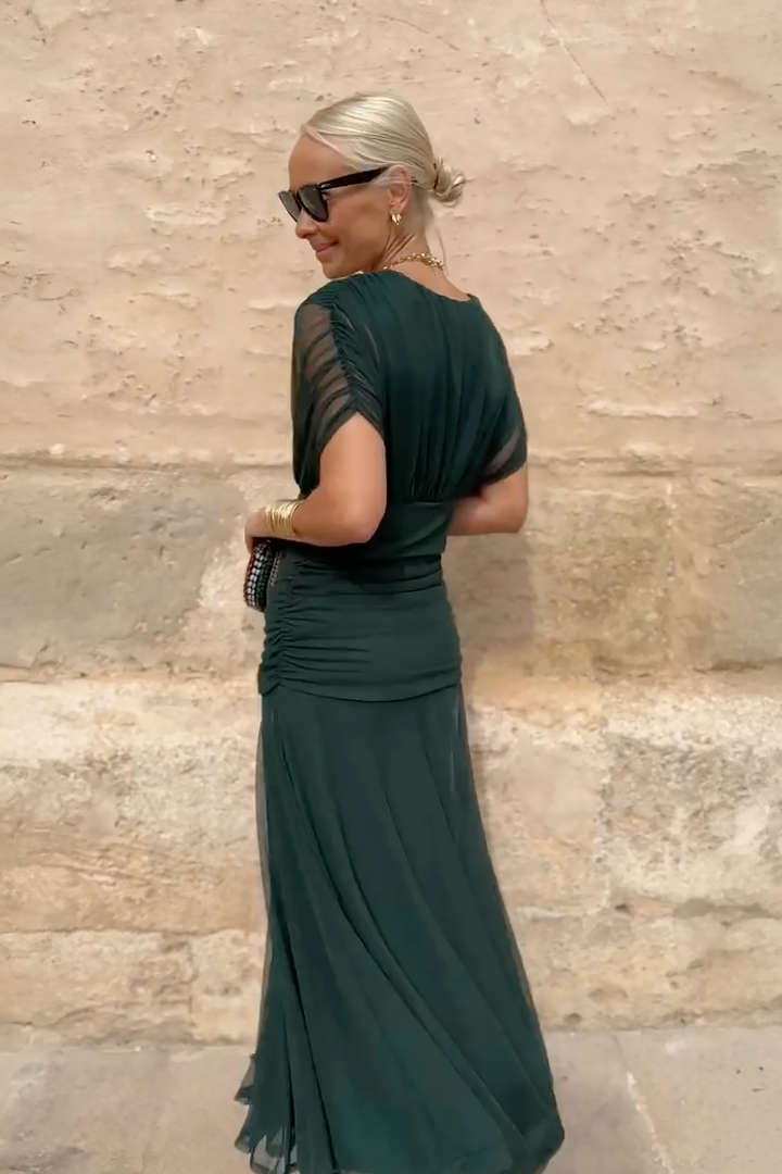 Woman in floral print V-neck maxi dress