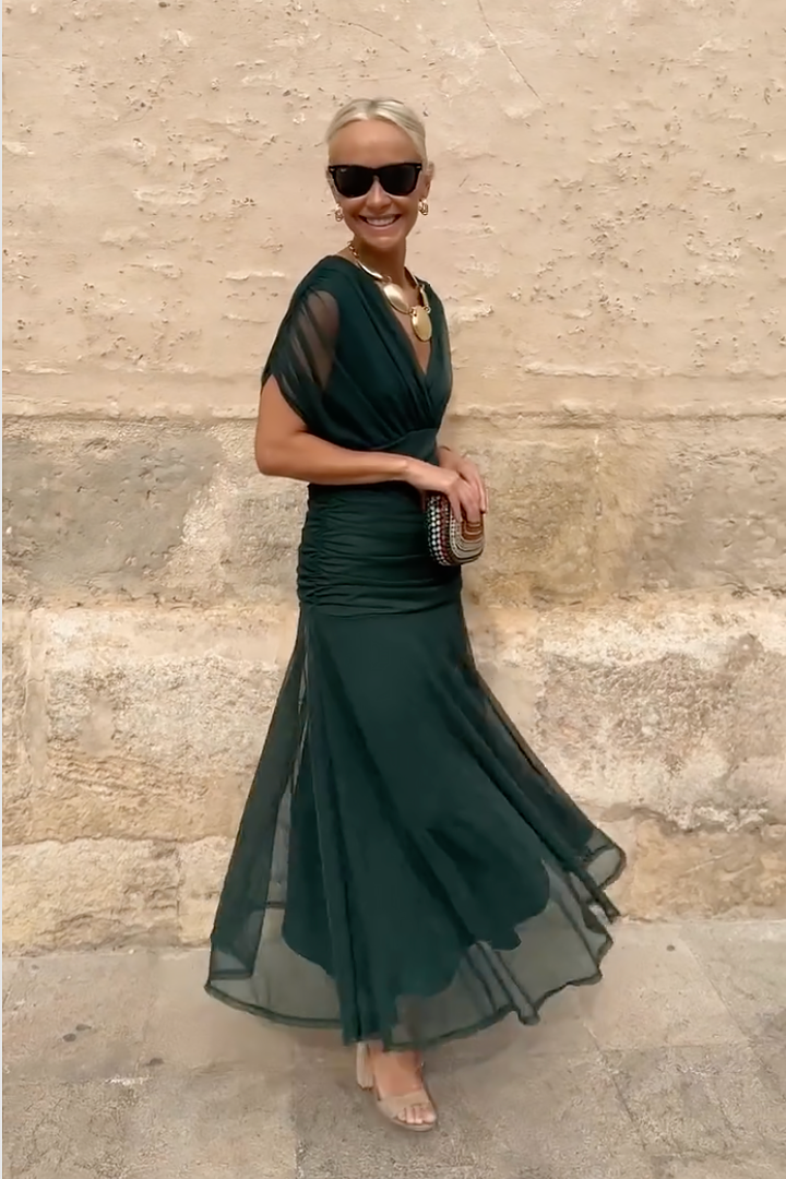 Woman in floral print V-neck maxi dress