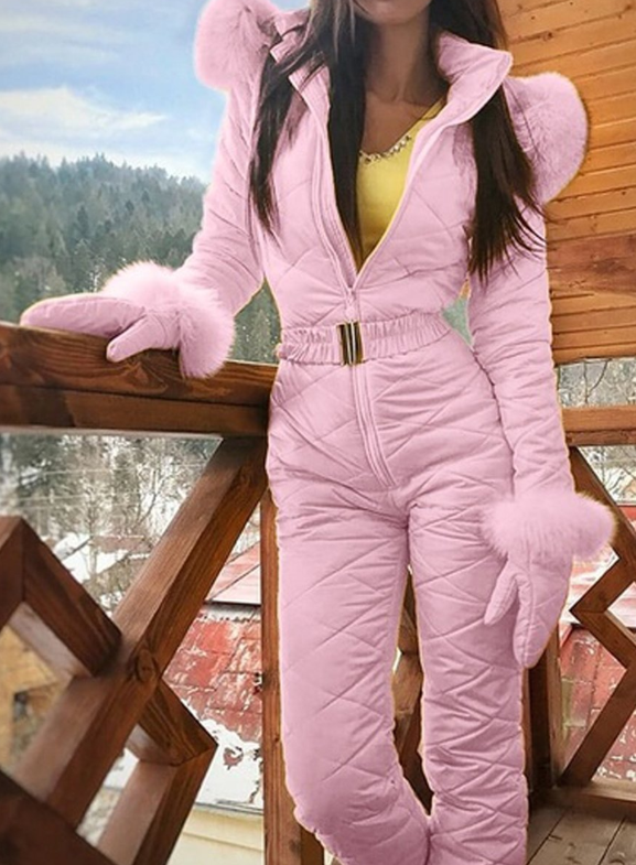 Woman wearing hooded winter ski coat in navy blue