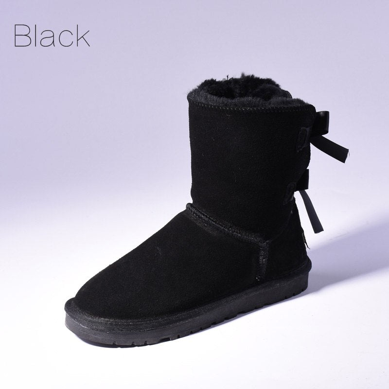 Women's mid-calf snow boots with fur lining and bow detail