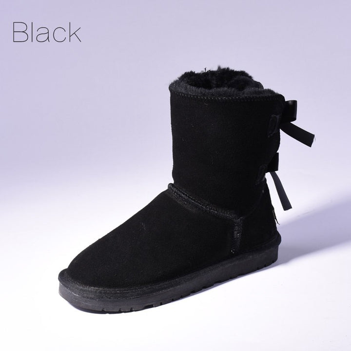 Women's mid-calf snow boots with fur lining and bow detail