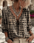 Daisy | Blouse à pois avec col en V et manches bouffantes