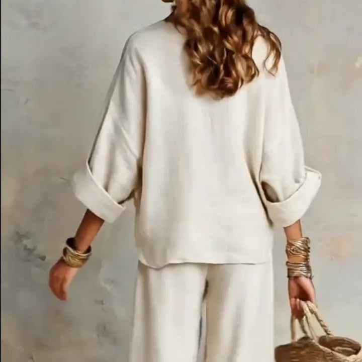 Woman wearing V-neck two piece set with wide leg pants