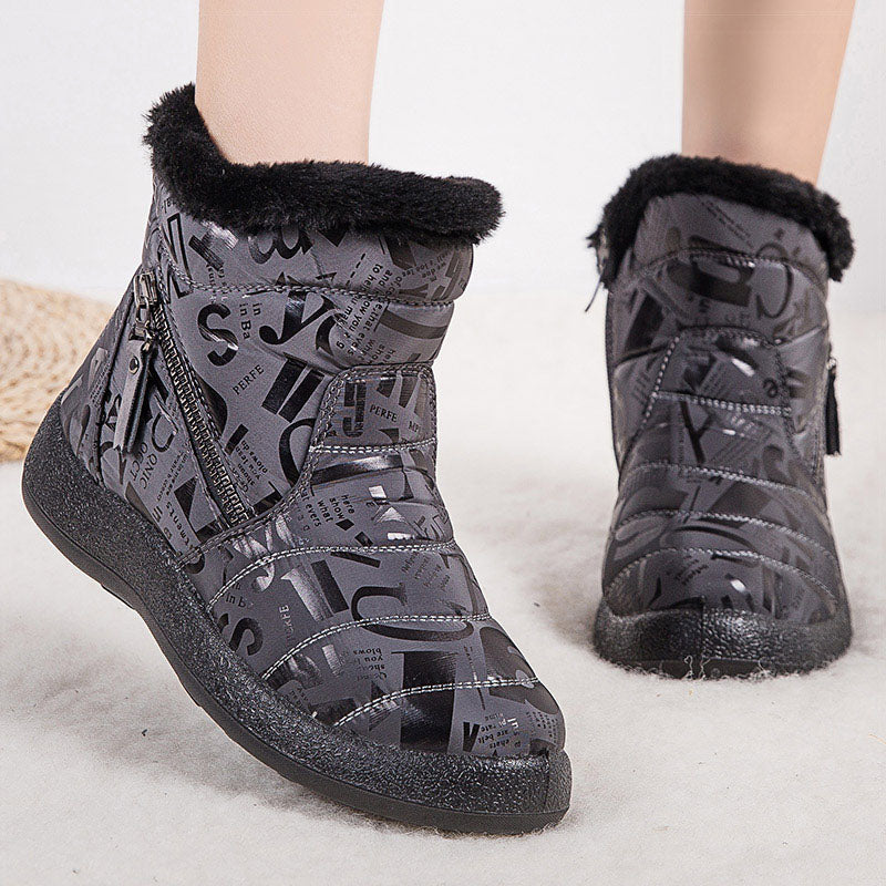 Woman wearing pink letter print plush-lined snow boots