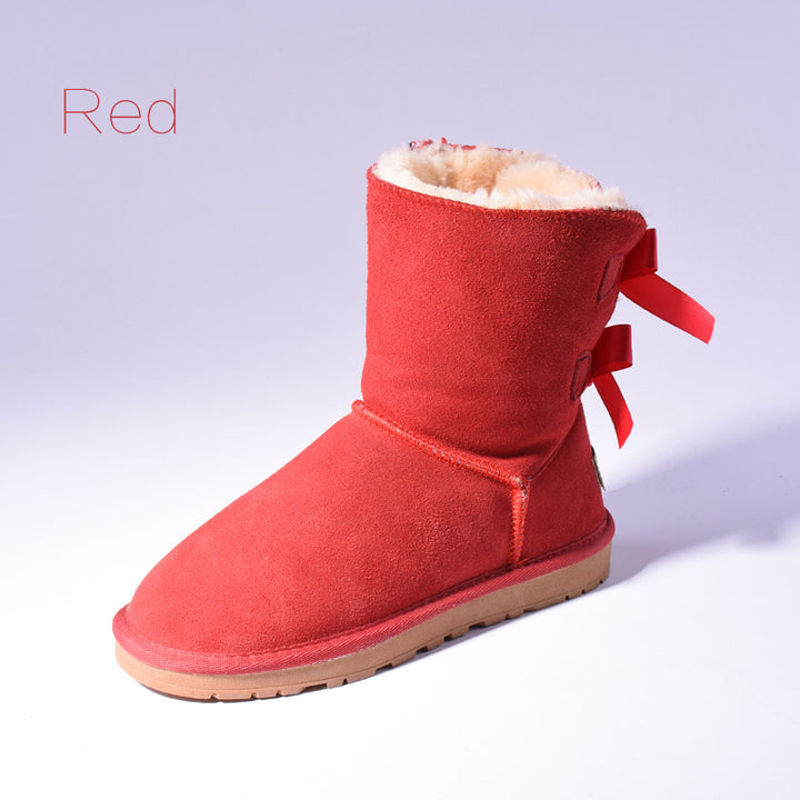 Women's mid-calf snow boots with fur lining and bow detail
