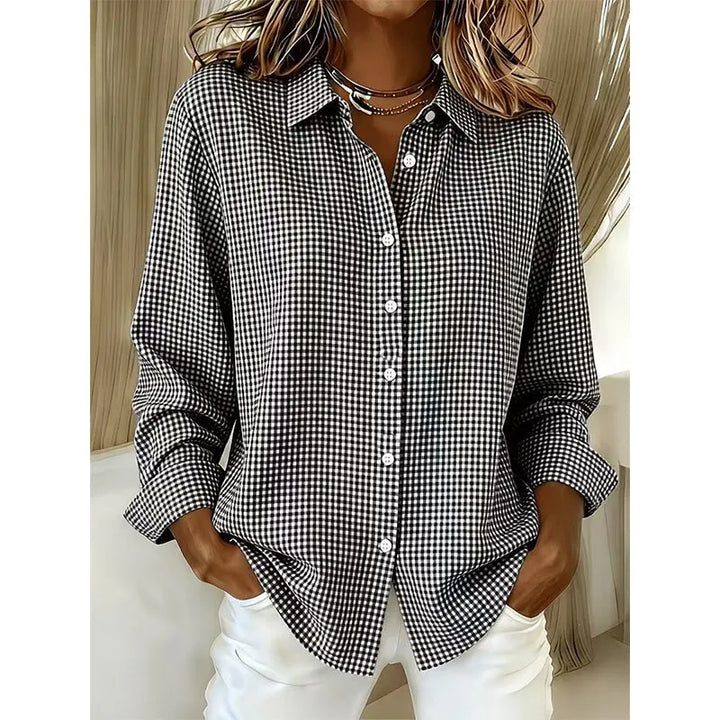 Woman wearing gingham button-up blouse with long sleeves
