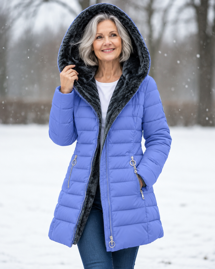 Woman wearing padded winter coat with hood