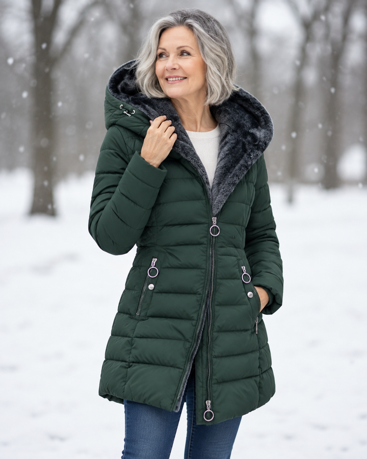 Woman wearing padded winter coat with hood