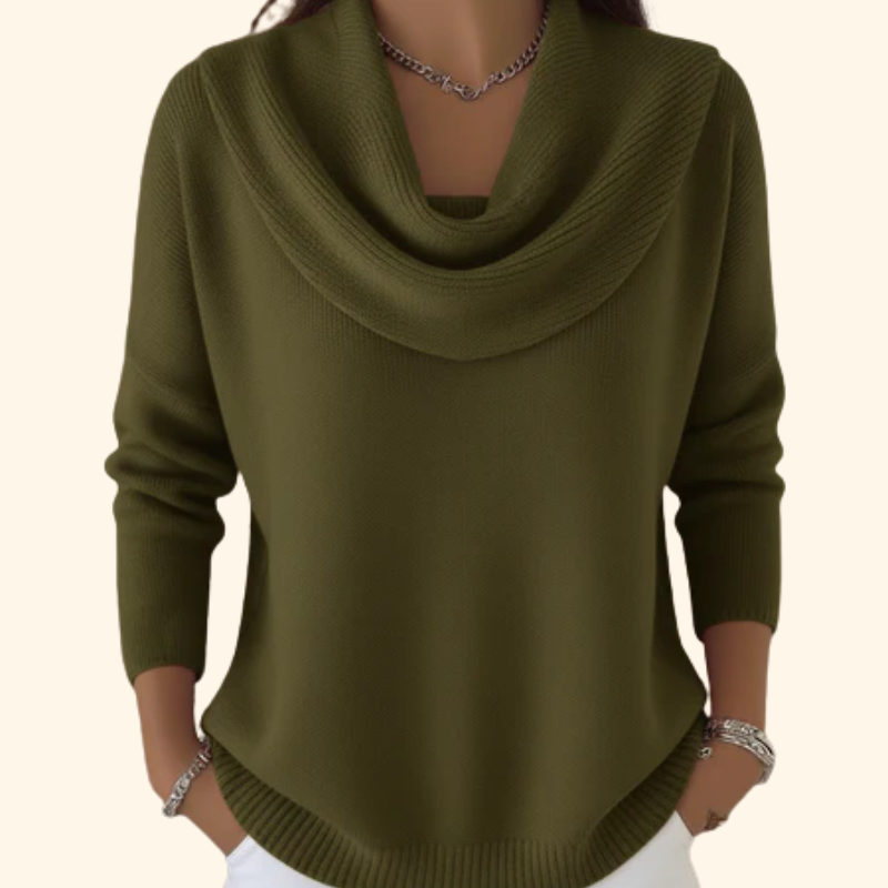Woman wearing cowl neck knit sweater with ribbed cuffs