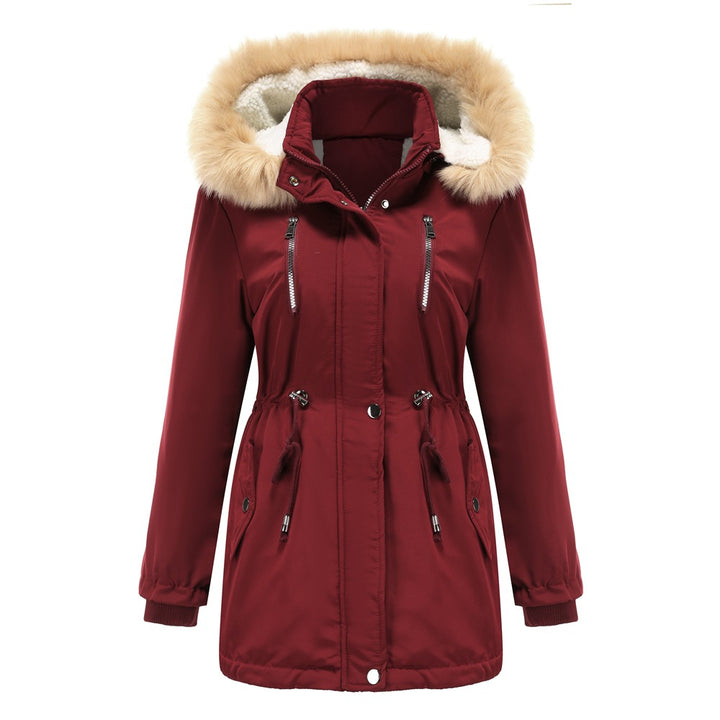 Woman wearing black hooded winter coat with faux wool collar