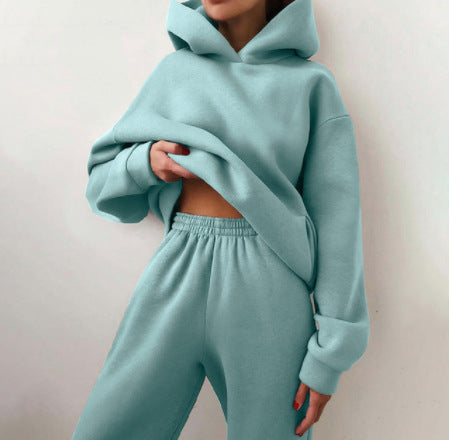 Woman wearing matching hooded knit tracksuit set – light green