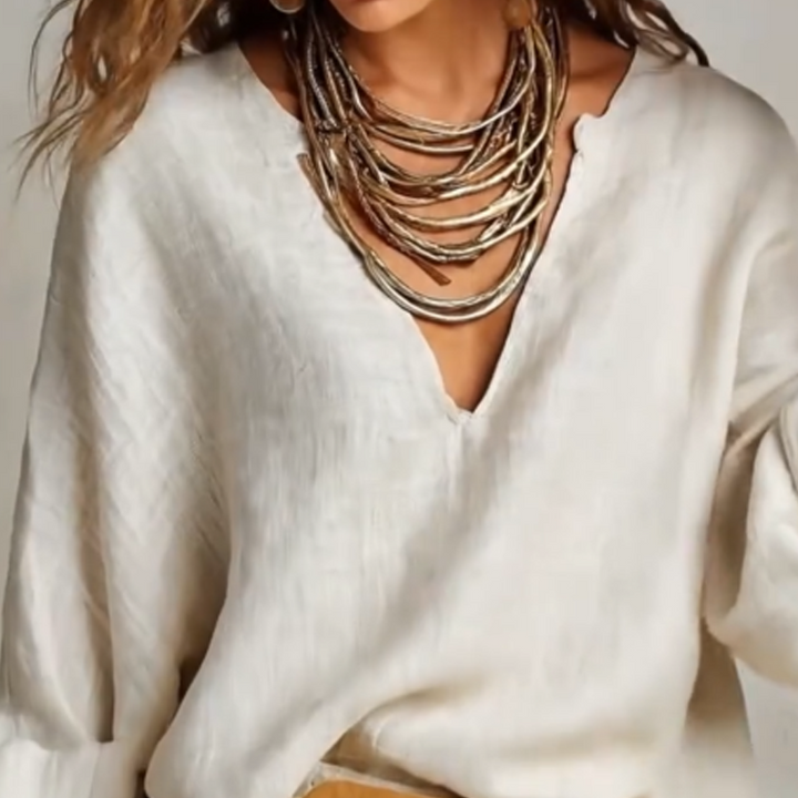 Woman wearing V-neck two piece set with wide leg pants
