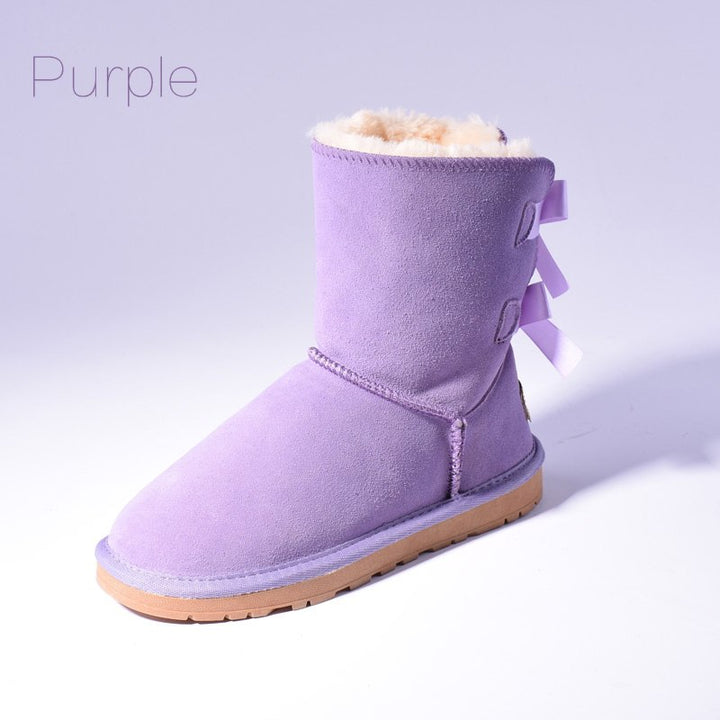 Women's mid-calf snow boots with fur lining and bow detail