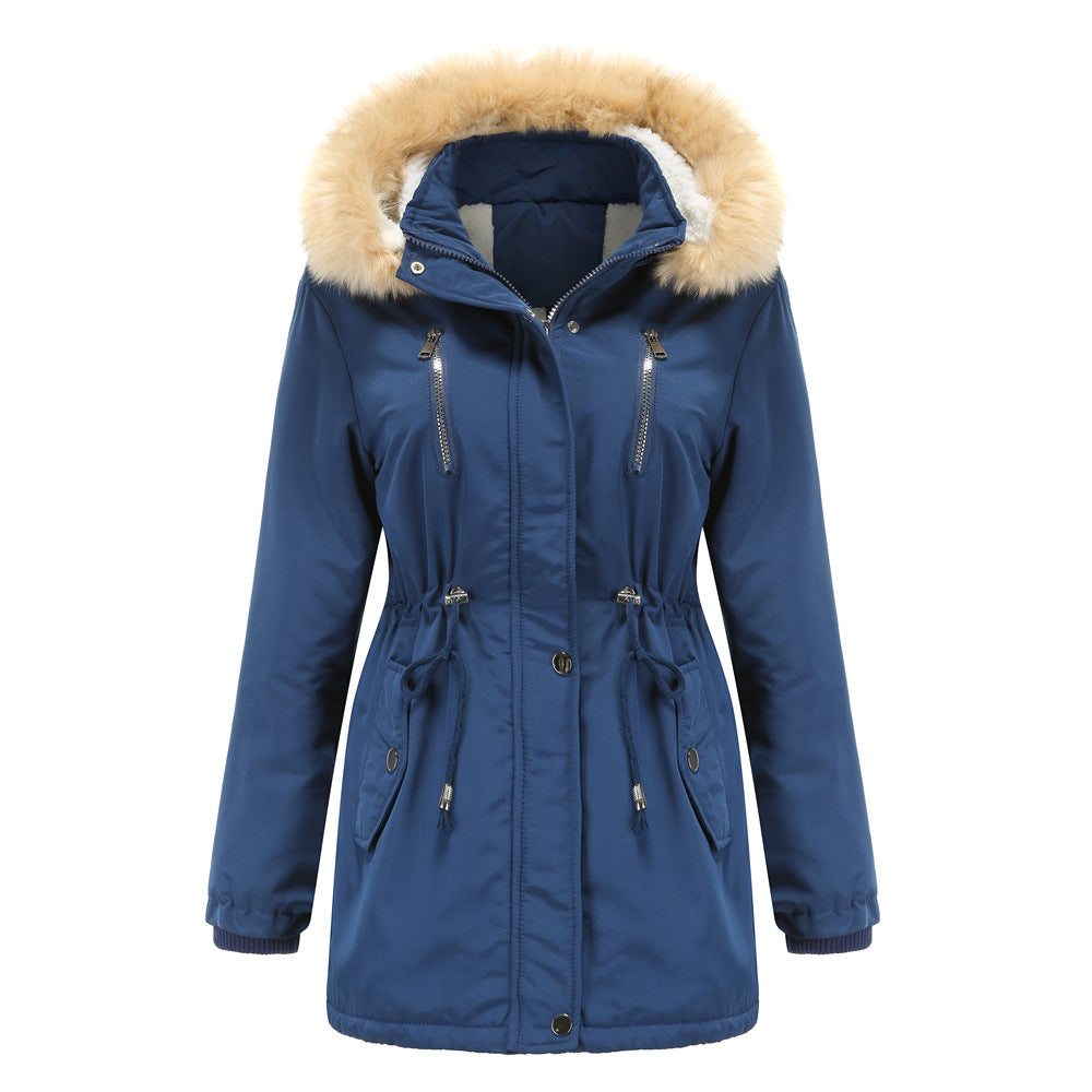 Woman wearing black hooded winter coat with faux wool collar