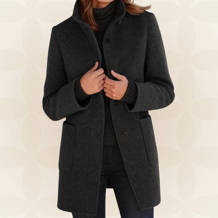 Woman wearing a classic coat with high collar