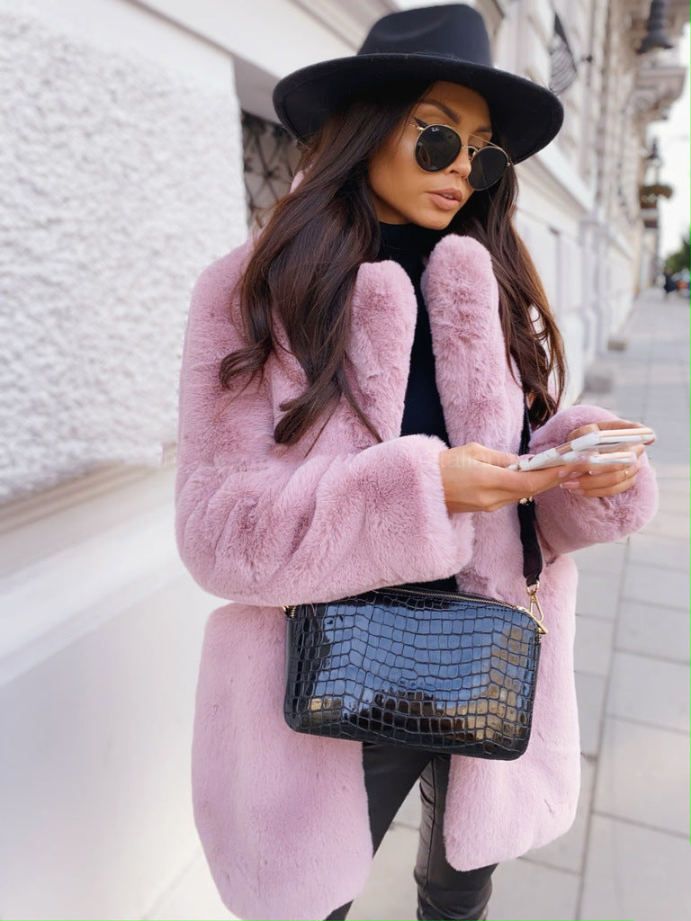 Woman wearing long faux fur coat with lapel collar