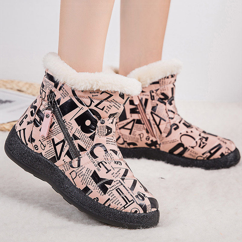 Woman wearing pink letter print plush-lined snow boots