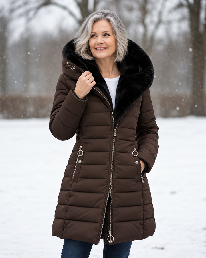 Woman wearing padded winter coat with hood