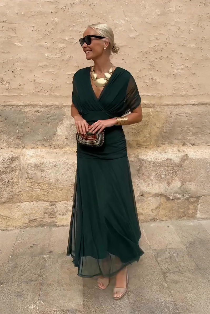 Woman in floral print V-neck maxi dress