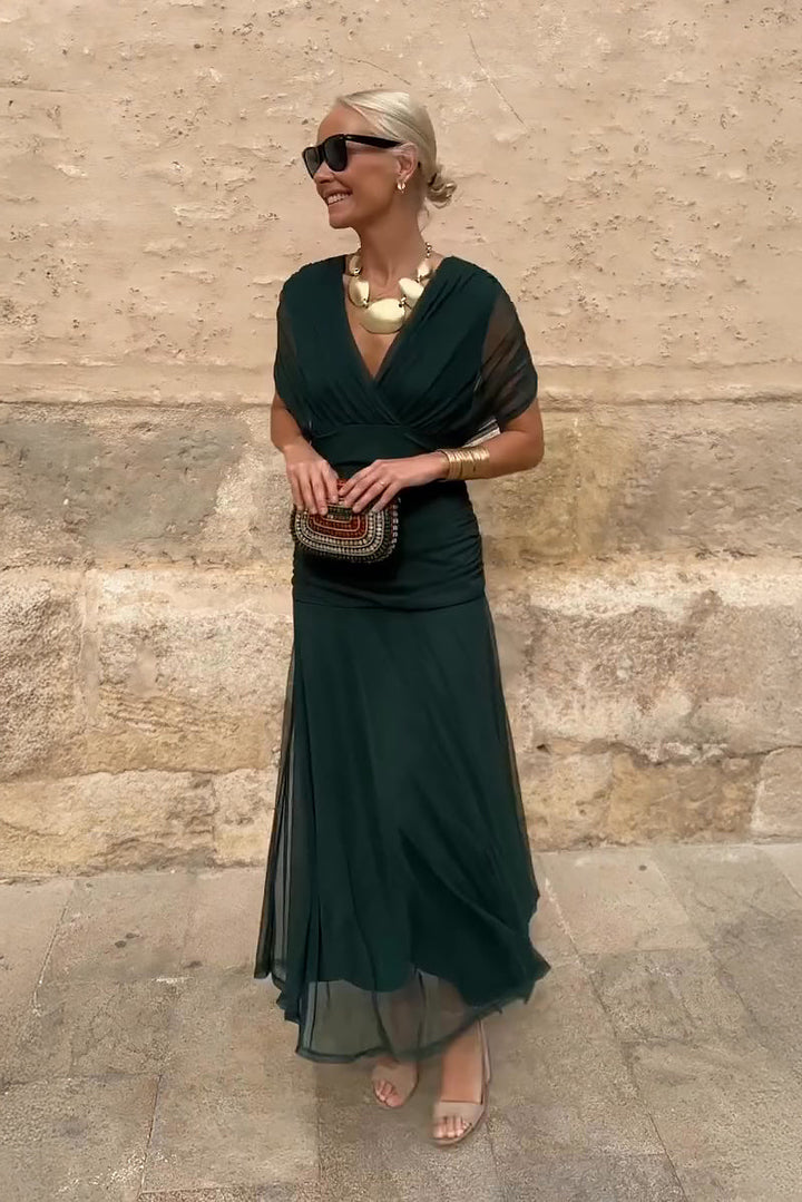 Woman in floral print V-neck maxi dress