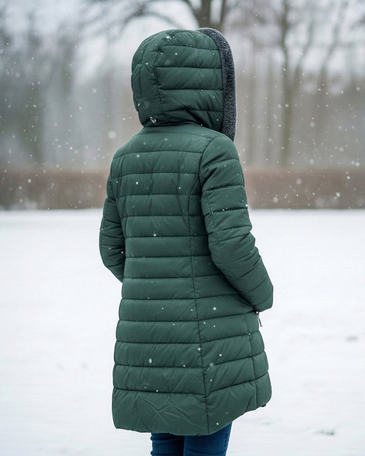 Woman wearing fleece-lined A-line puffer coat outdoors