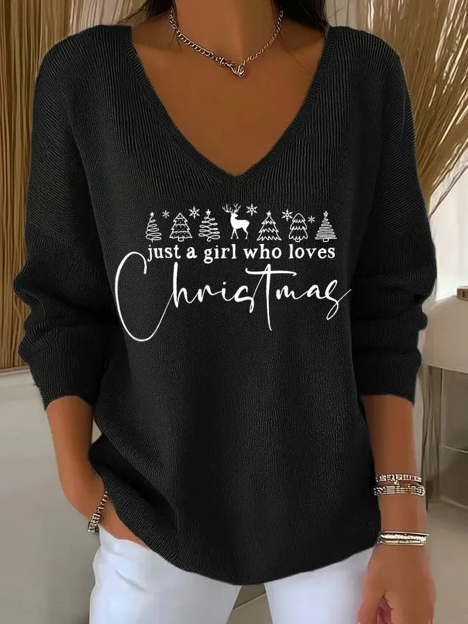 Woman wearing festive V-neck Christmas sweater indoors
