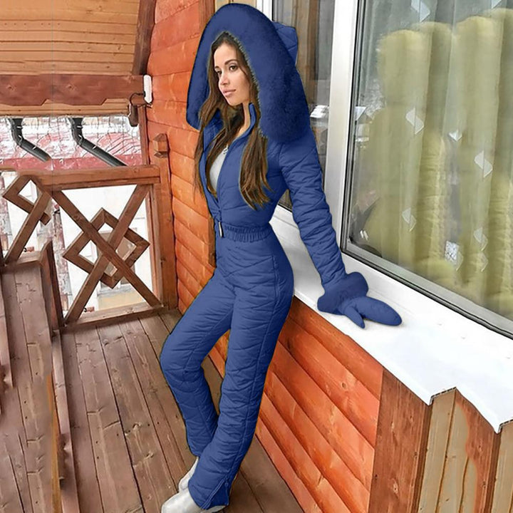 Woman wearing hooded winter ski coat in navy blue
