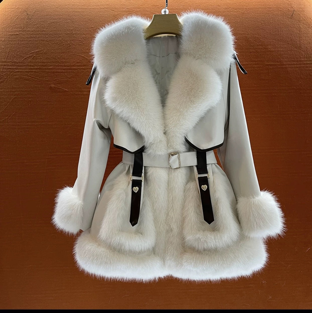 Woman wearing beige faux fur coat with fur collar
