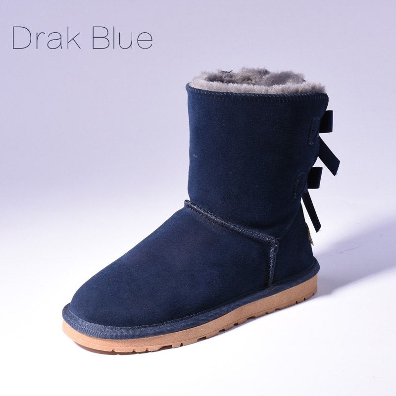 Women's mid-calf snow boots with fur lining and bow detail