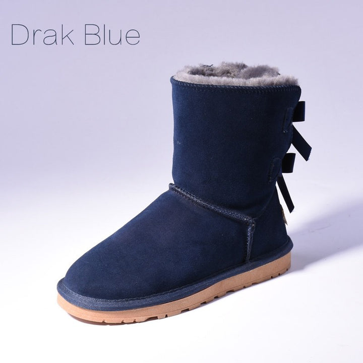 Women's mid-calf snow boots with fur lining and bow detail
