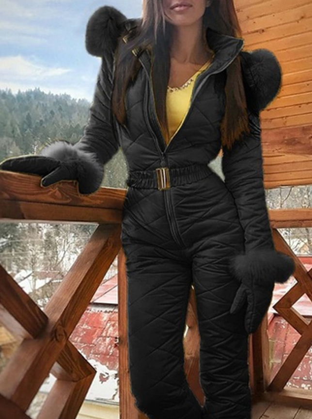 Woman wearing hooded winter ski coat in navy blue