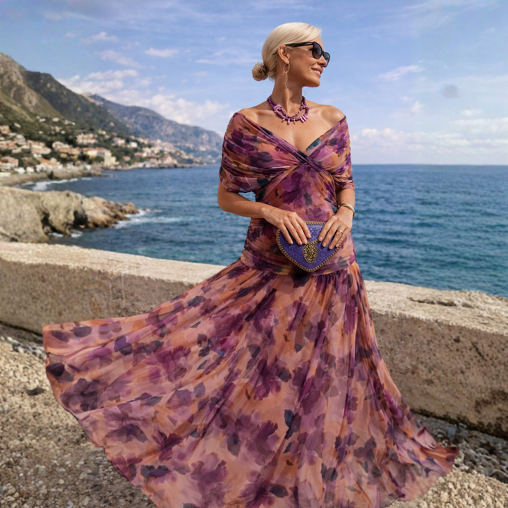 Woman wearing a flowing maxi dress with crossed V-neck