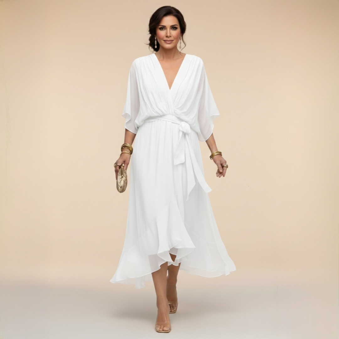 Woman wearing flowy V-neck dress, front view